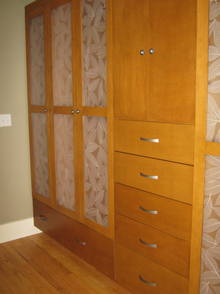 Large trendy gender-neutral light wood floor walk-in closet photo in Other with shaker cabinets and white cabinets