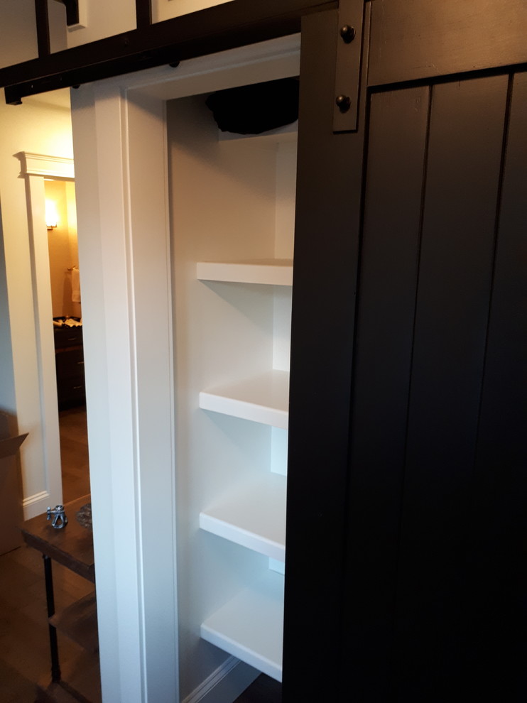 New closets with sheving and crown moulding on existing Ikea
