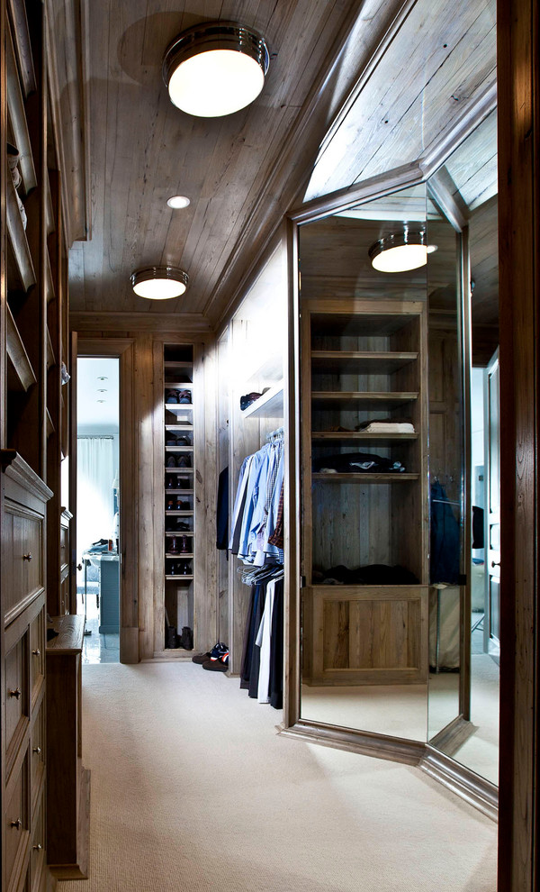 Inspiration for a mid-sized timeless gender-neutral carpeted and beige floor walk-in closet remodel in Charlotte with white cabinets and recessed-panel cabinets