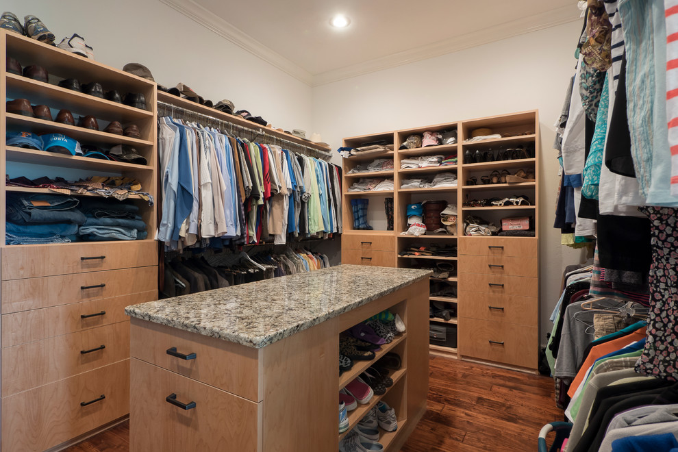 Inspiration for a classic walk-in wardrobe in Miami with flat-panel cabinets, light wood cabinets and medium hardwood flooring.