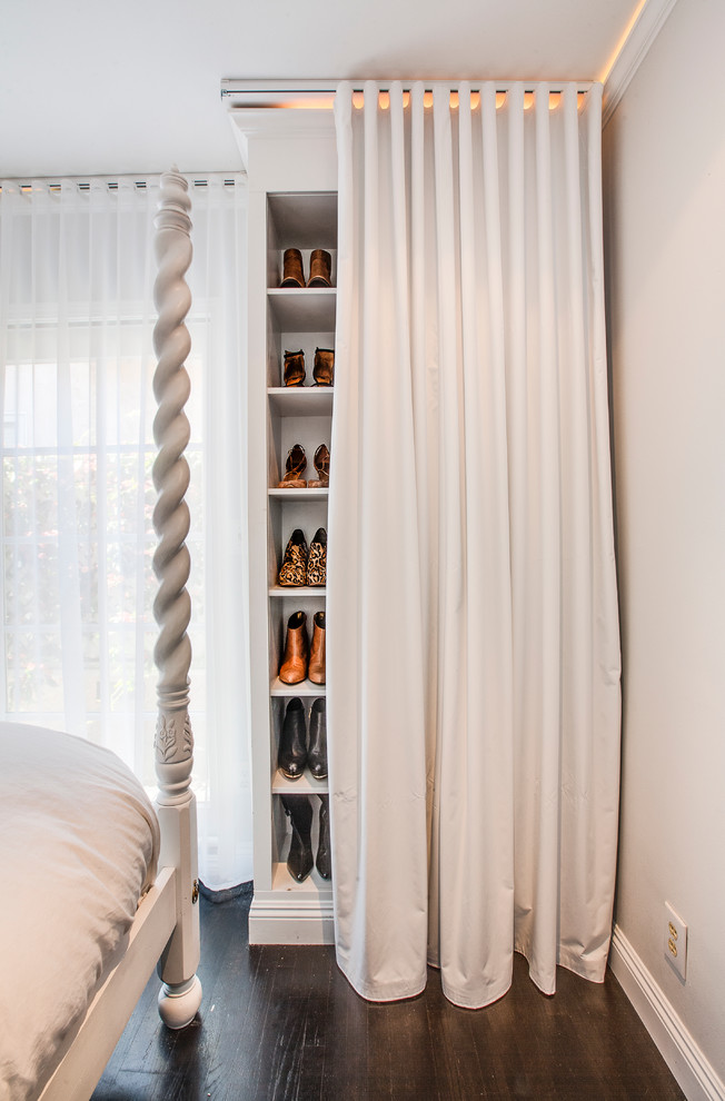 Transitional women's dark wood floor reach-in closet photo in Los Angeles with open cabinets and white cabinets