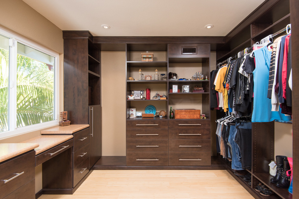 Huge asian gender-neutral light wood floor walk-in closet photo in San Diego with shaker cabinets and dark wood cabinets