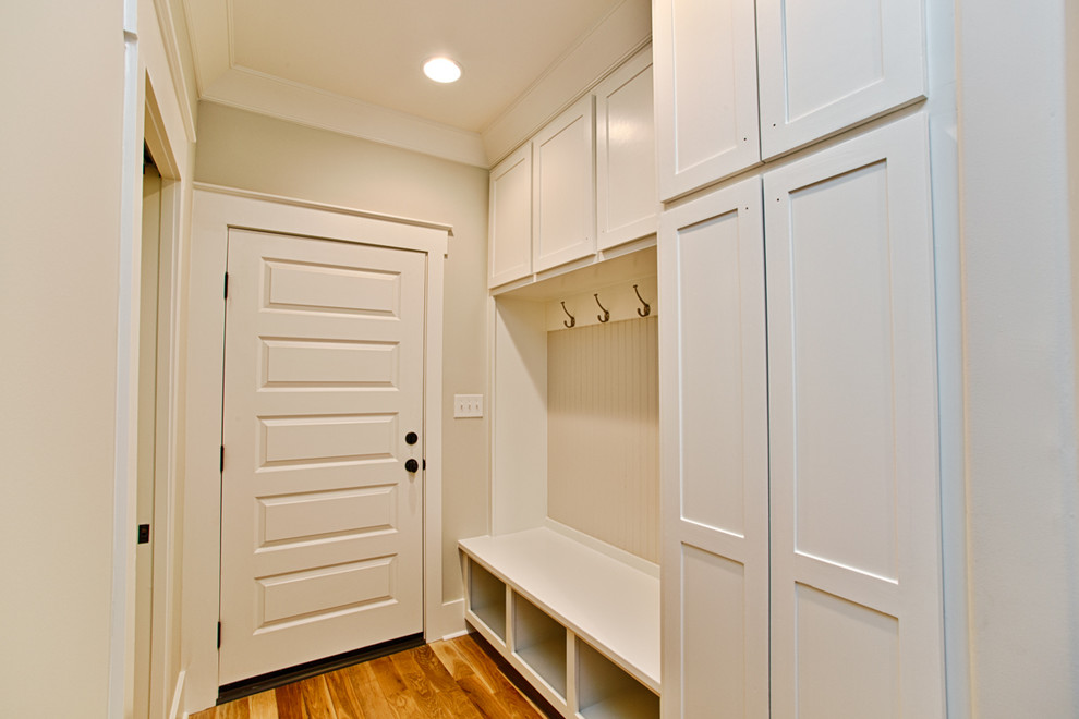 Closet - mid-sized cottage closet idea in Other