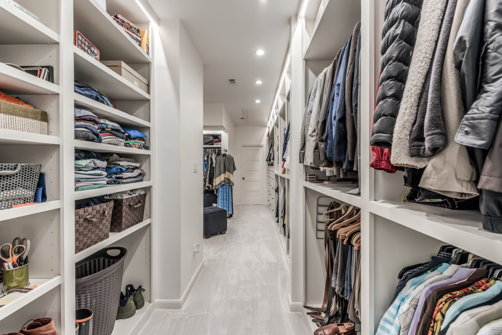 Built-in closet - large french country gender-neutral carpeted and white floor built-in closet idea in Houston with white cabinets