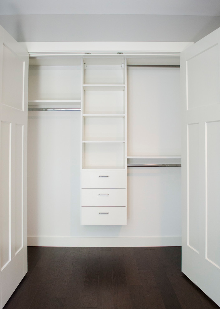 Example of a large minimalist gender-neutral carpeted and brown floor walk-in closet design in Other with open cabinets and white cabinets