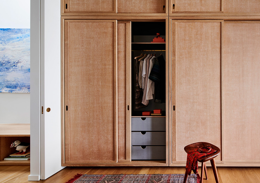 Closet - large 1950s light wood floor and brown floor closet idea in New York