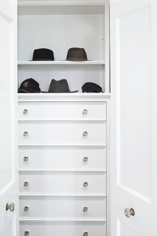 Small trendy men's reach-in closet photo in Santa Barbara with white cabinets
