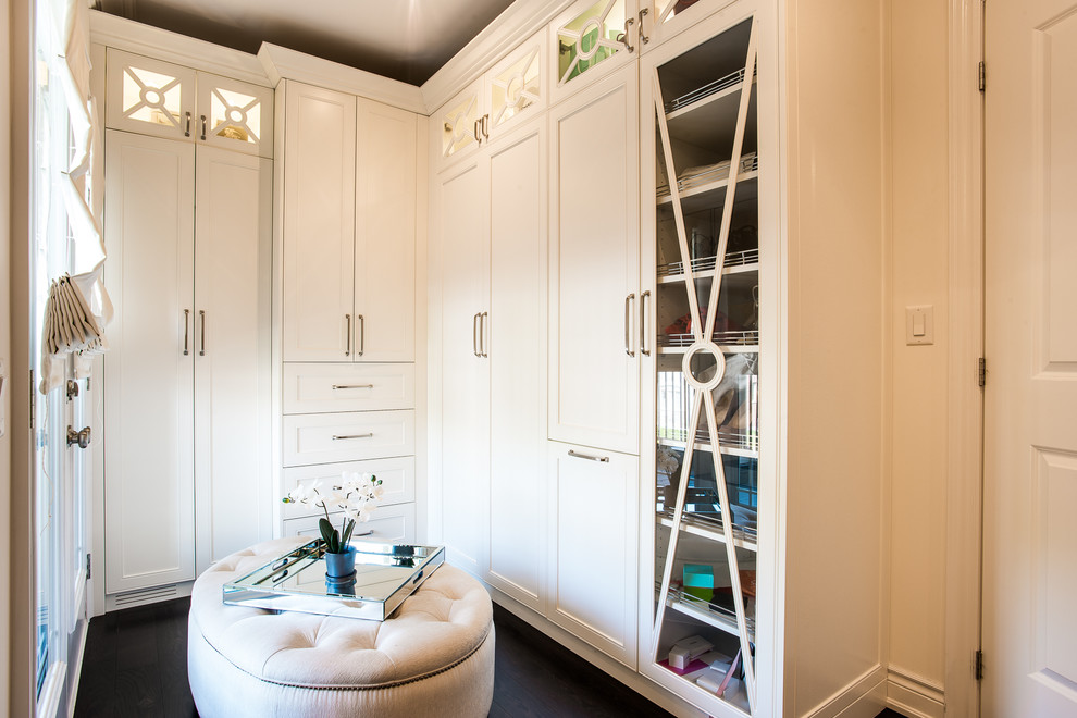 Photo of a medium sized classic gender neutral walk-in wardrobe in Toronto with shaker cabinets, white cabinets, dark hardwood flooring and brown floors.