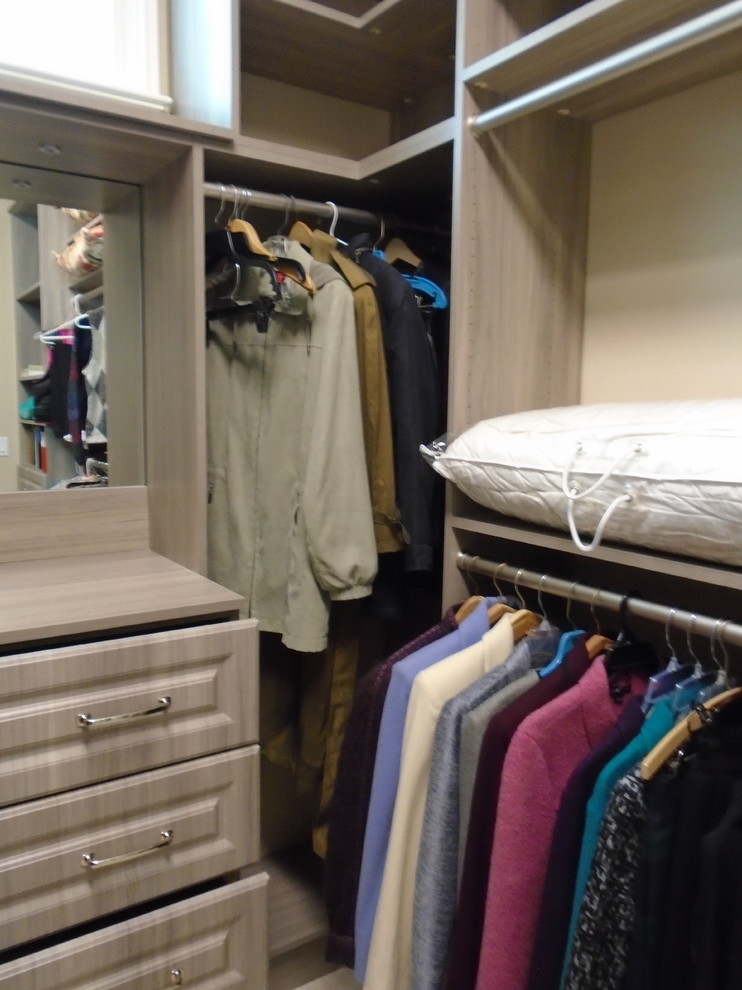 Large traditional gender neutral walk-in wardrobe in Miami with raised-panel cabinets, grey cabinets and marble flooring.