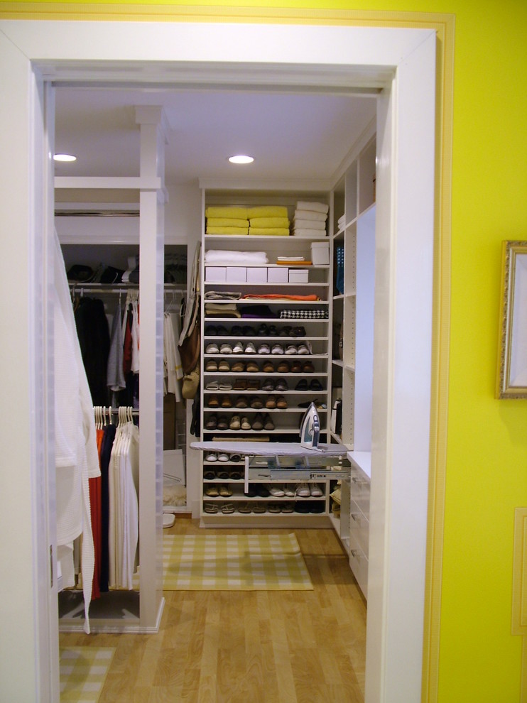 Inspiration for a large contemporary gender neutral walk-in wardrobe in San Diego with open cabinets and white cabinets.