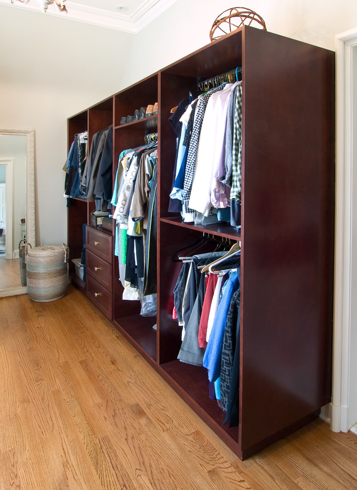 Inspiration for a large victorian gender-neutral light wood floor and brown floor dressing room remodel in Philadelphia with open cabinets and dark wood cabinets