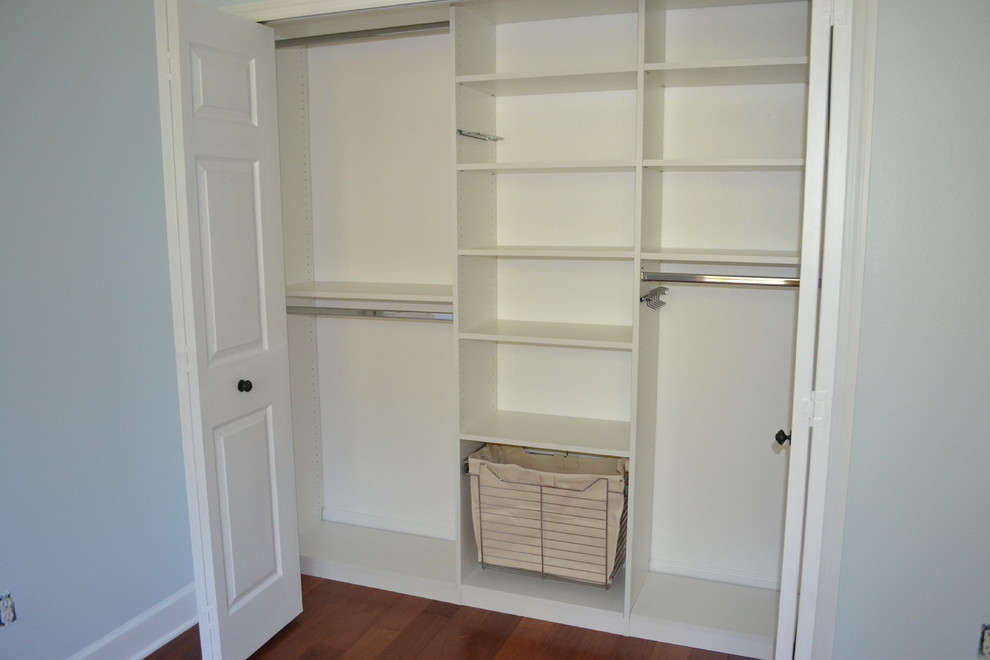 Photo of a contemporary gender neutral standard wardrobe in Orlando with white cabinets.