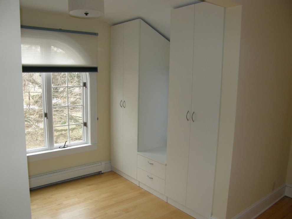 This is an example of a medium sized classic standard wardrobe in Minneapolis with open cabinets and white cabinets.