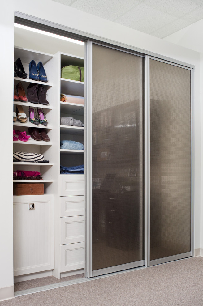 Example of a transitional reach-in closet design in Philadelphia with recessed-panel cabinets and white cabinets