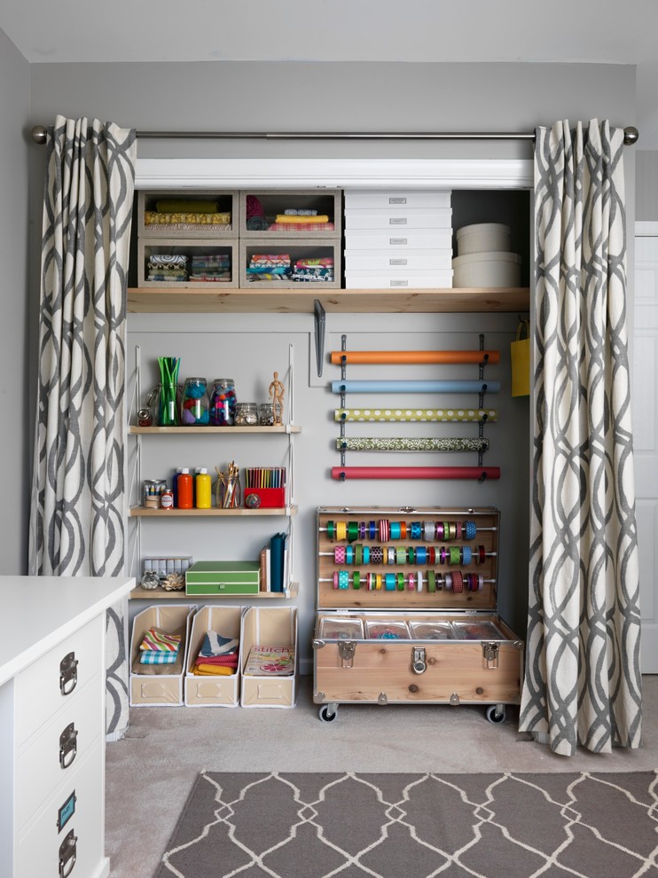 Transitional carpeted reach-in closet photo in New York with light wood cabinets