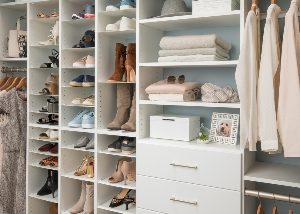 Mid-sized elegant women's walk-in closet photo in Tampa with open cabinets and white cabinets
