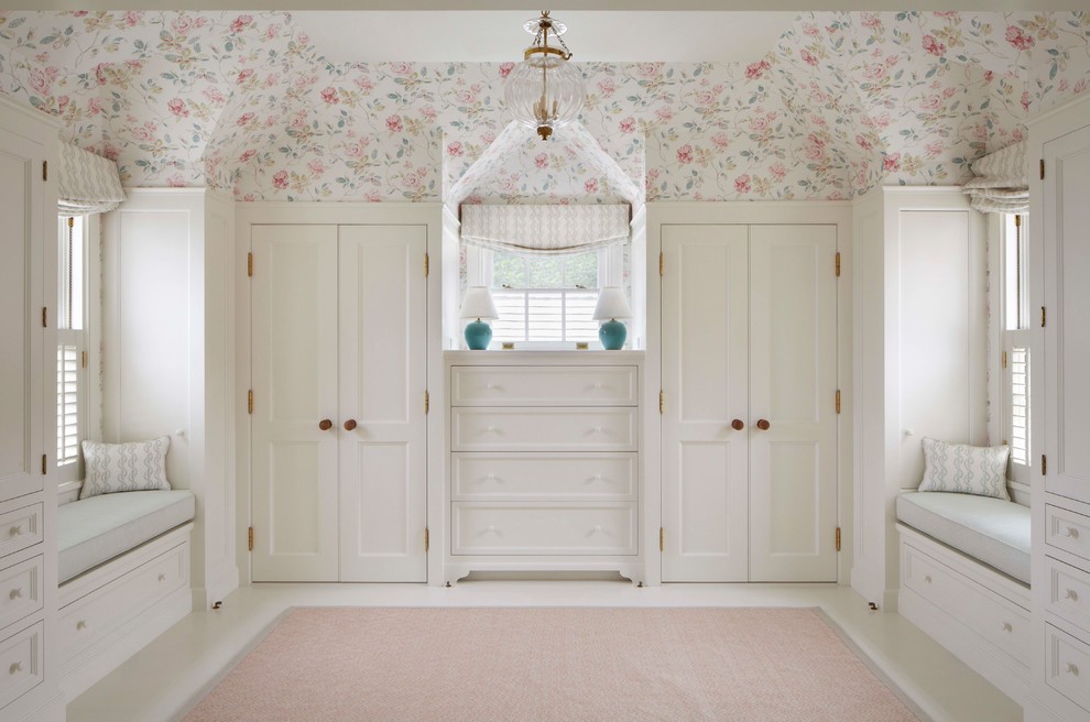 Inspiration for a timeless women's dressing room remodel in Boston with recessed-panel cabinets and white cabinets