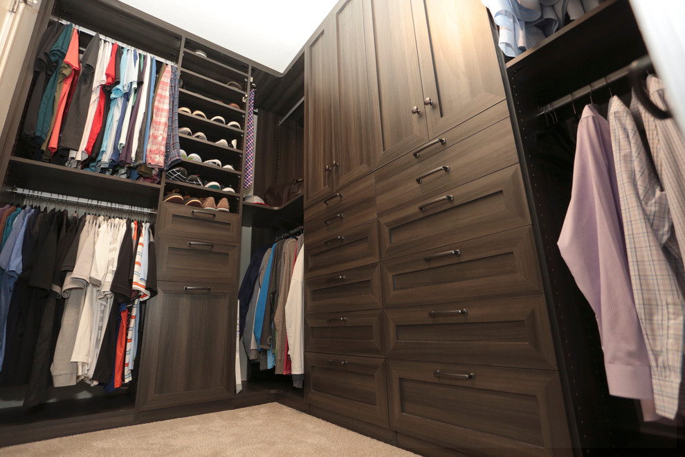 Inspiration for a medium sized contemporary walk-in wardrobe for men in Portland with shaker cabinets, medium wood cabinets and carpet.