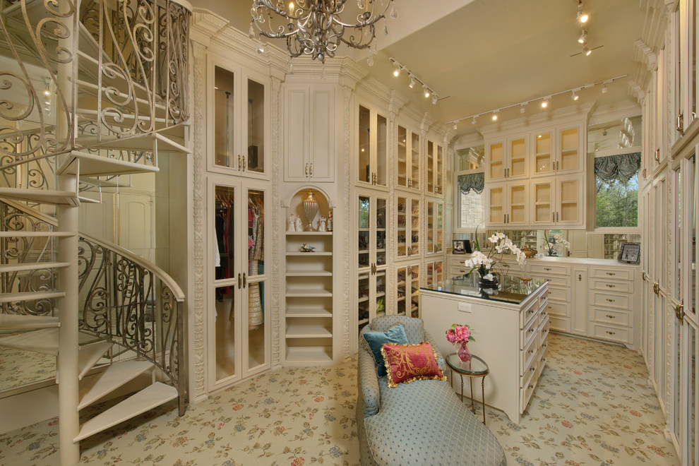 Design ideas for a mediterranean dressing room in Houston with beige cabinets.
