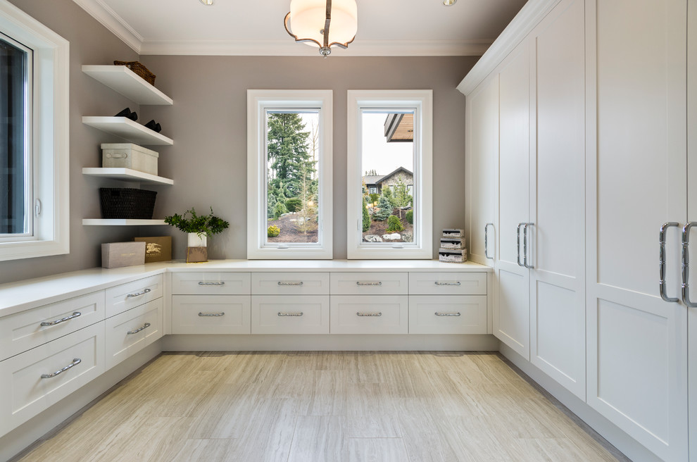 Design ideas for an expansive rustic gender neutral dressing room in Vancouver with shaker cabinets, white cabinets, porcelain flooring and grey floors.