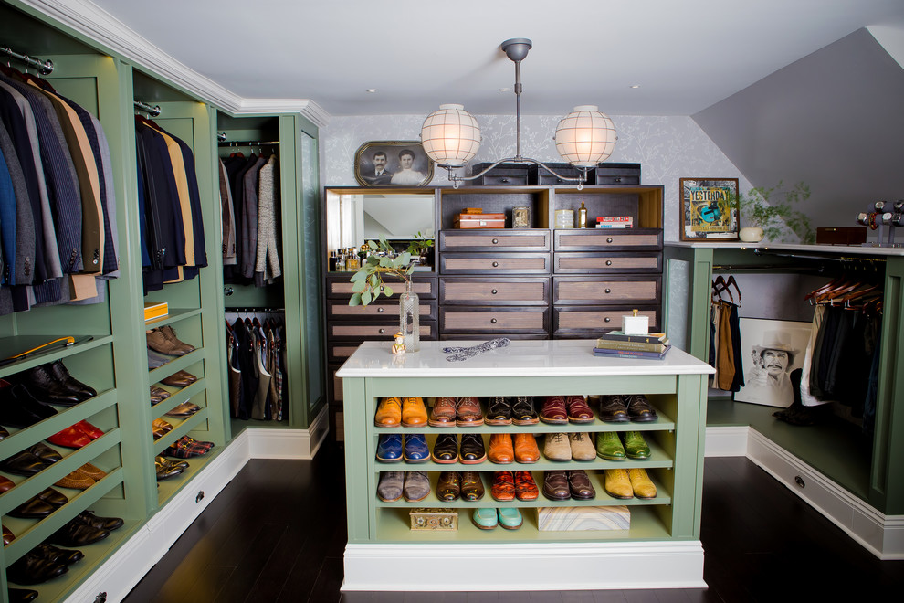 This is an example of a large classic walk-in wardrobe for men in Other with open cabinets, green cabinets, bamboo flooring and brown floors.