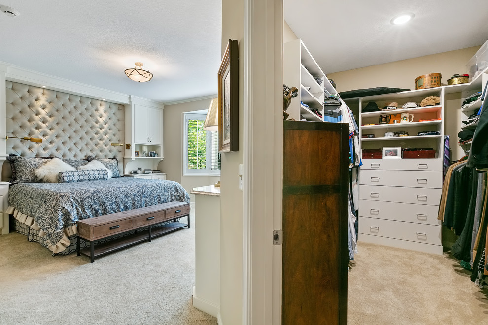 Inspiration for a mid-sized timeless carpeted and beige floor walk-in closet remodel in Minneapolis with flat-panel cabinets and white cabinets