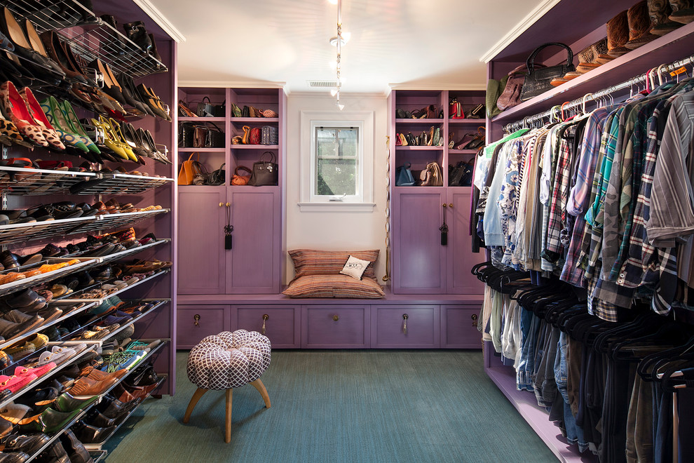 Design ideas for a large eclectic dressing room for women in Santa Barbara with open cabinets and carpet.