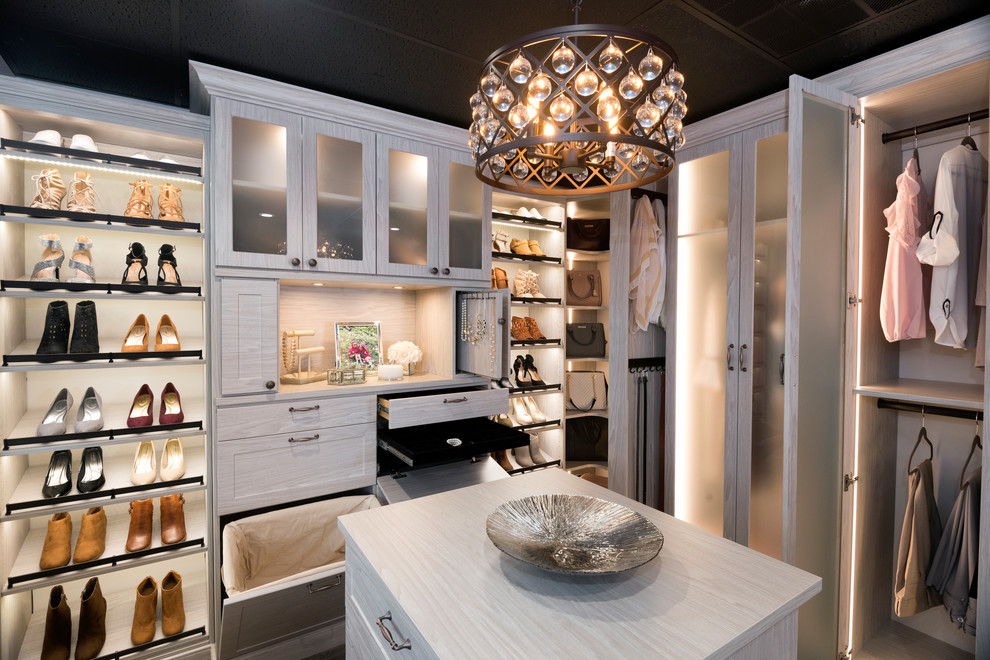 Inspiration for a large contemporary women's brown floor walk-in closet remodel in Other with shaker cabinets and white cabinets