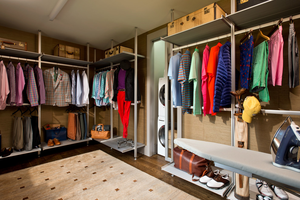 This is an example of a large contemporary gender neutral walk-in wardrobe in Boston with dark hardwood flooring.
