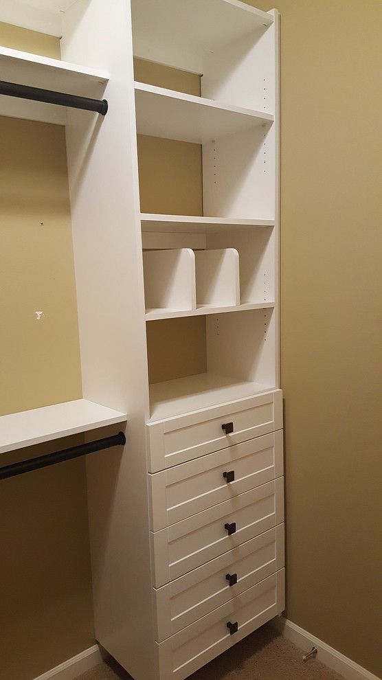 Photo of a medium sized contemporary gender neutral walk-in wardrobe in Seattle with shaker cabinets and white cabinets.