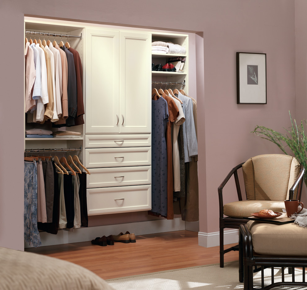 Inspiration for a mid-sized transitional gender-neutral reach-in closet remodel in Birmingham with raised-panel cabinets
