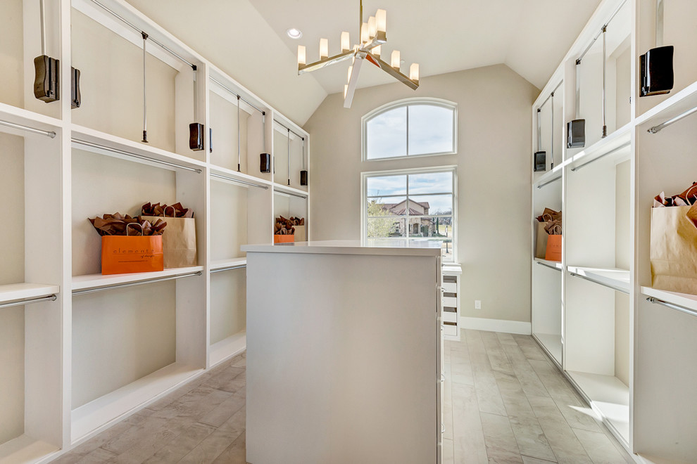 Example of a large transitional gender-neutral porcelain tile walk-in closet design in Dallas with beaded inset cabinets and white cabinets