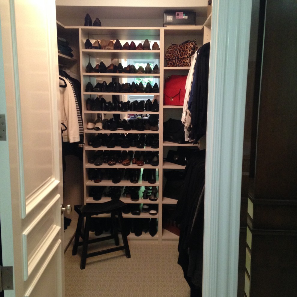 Walk-in closet - small modern men's carpeted walk-in closet idea in Los Angeles with light wood cabinets