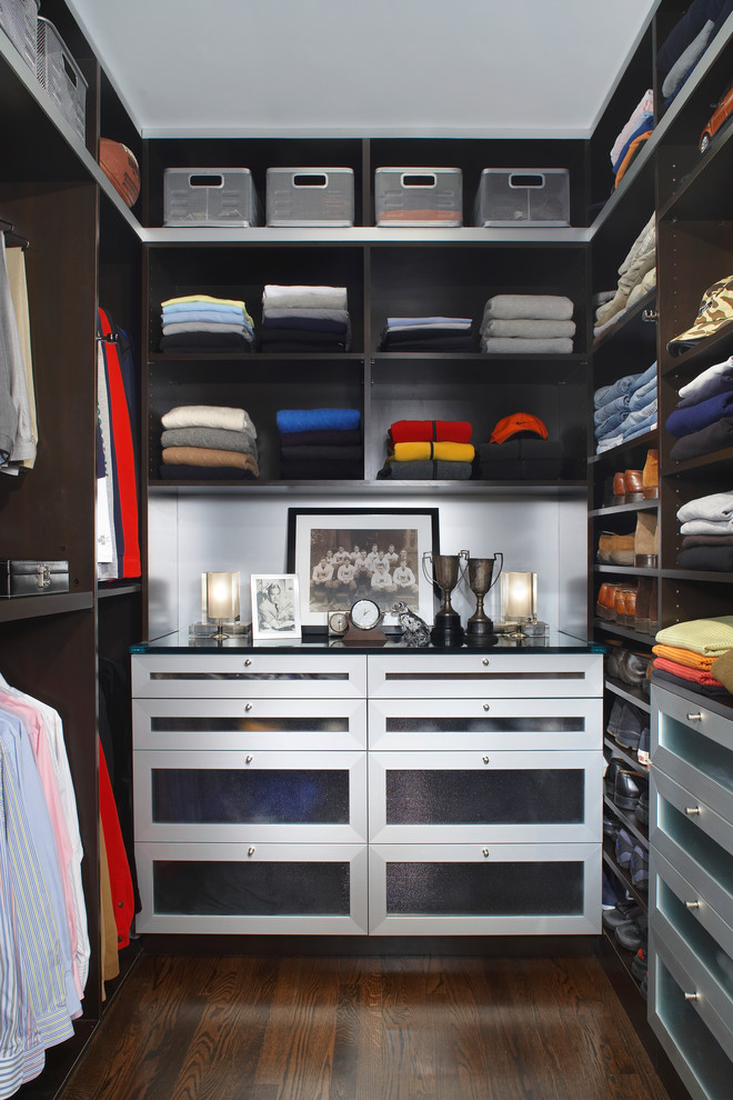 Inspiration for a large contemporary men's dark wood floor and brown floor walk-in closet remodel in Detroit with open cabinets and dark wood cabinets
