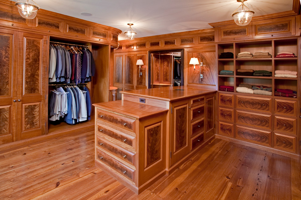 Design ideas for a classic dressing room for men in Philadelphia with medium wood cabinets.