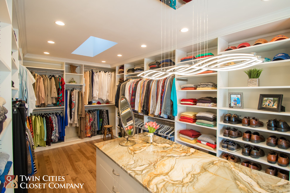 Inspiration for a large contemporary walk-in closet remodel in Minneapolis