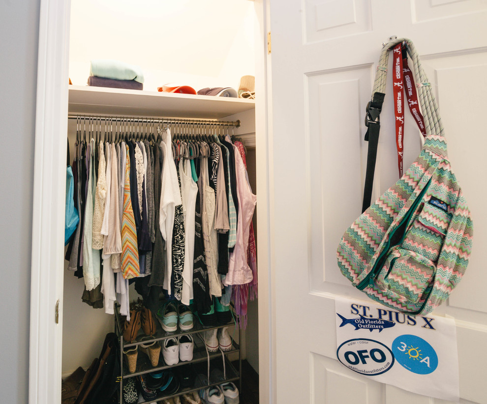 Reach-in closet - women's dark wood floor reach-in closet idea in Atlanta
