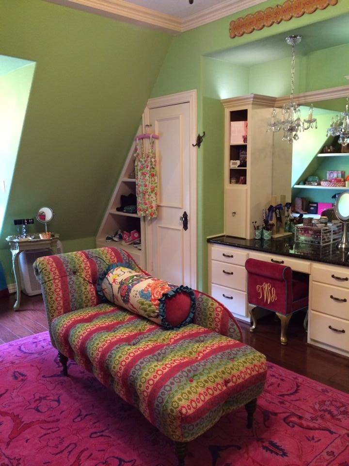 Inspiration for a large zen women's dark wood floor walk-in closet remodel in Austin