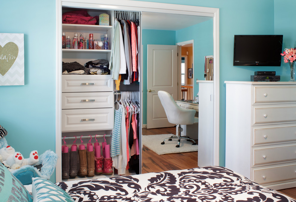 This is an example of a small contemporary standard wardrobe for women in New York with raised-panel cabinets and white cabinets.