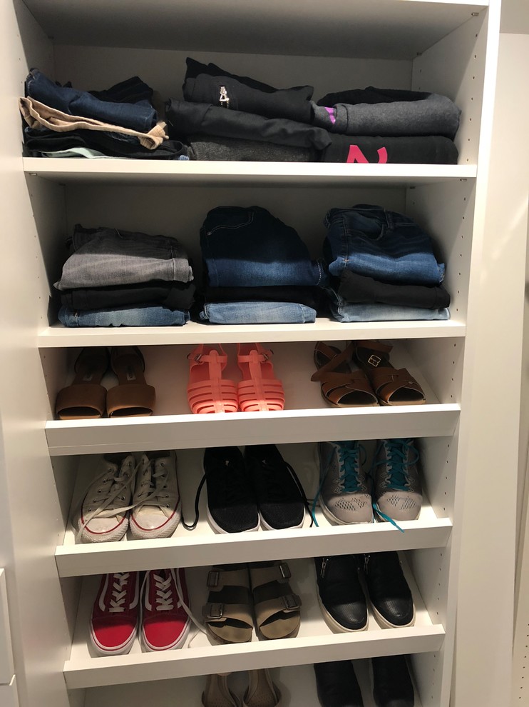 Walk-in closet - small modern women's carpeted and gray floor walk-in closet idea in Salt Lake City with flat-panel cabinets and white cabinets