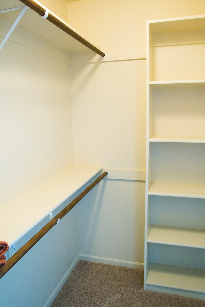Example of a mid-sized classic gender-neutral carpeted and gray floor walk-in closet design in Kansas City