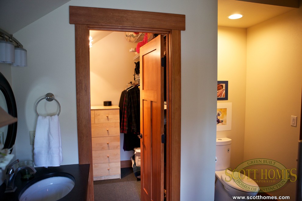 Inspiration for a mid-sized farmhouse walk-in closet remodel in Seattle
