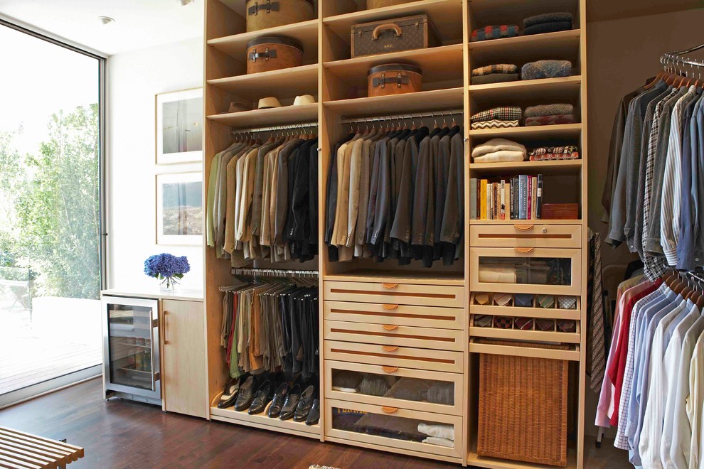 This is an example of a contemporary walk-in wardrobe in Los Angeles.