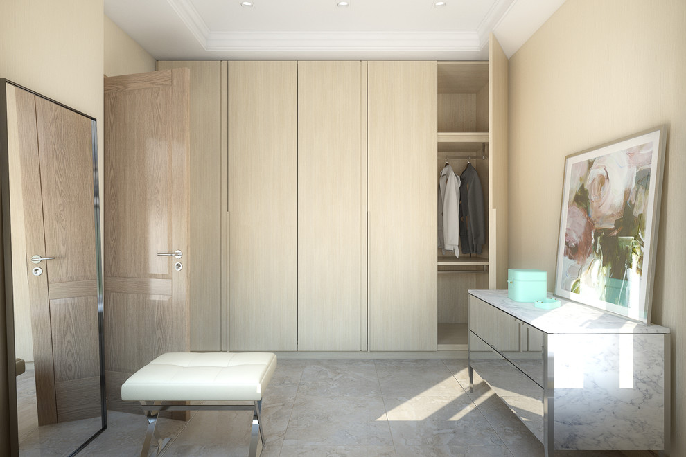 Foto de armario y vestidor unisex actual con puertas de armario de madera clara y suelo de baldosas de cerámica