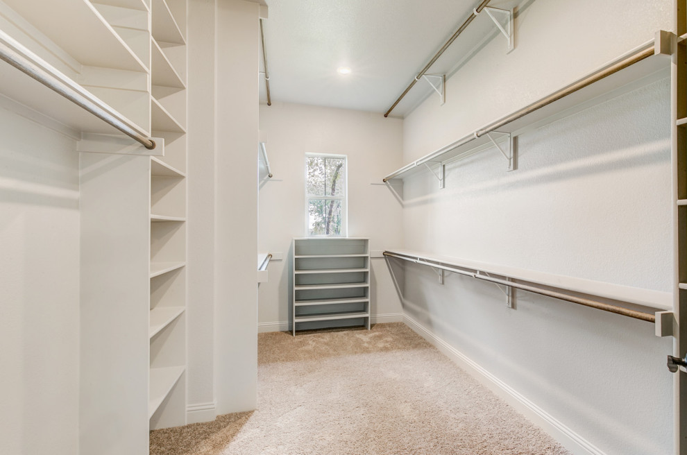 Inspiration for a mid-sized transitional gender-neutral carpeted and beige floor walk-in closet remodel in Dallas with open cabinets and white cabinets