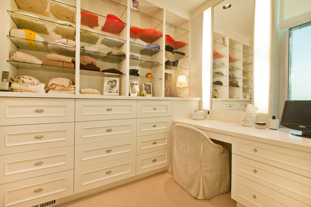Traditional dressing room for women in Omaha with white cabinets and recessed-panel cabinets.