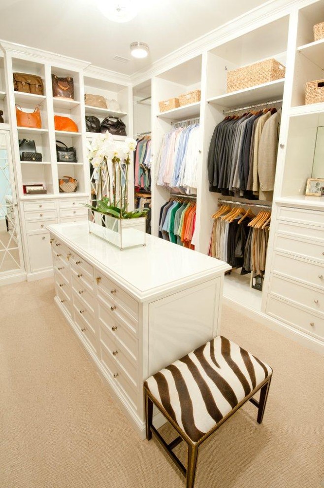 Inspiration for a traditional walk-in wardrobe in Houston with white cabinets.