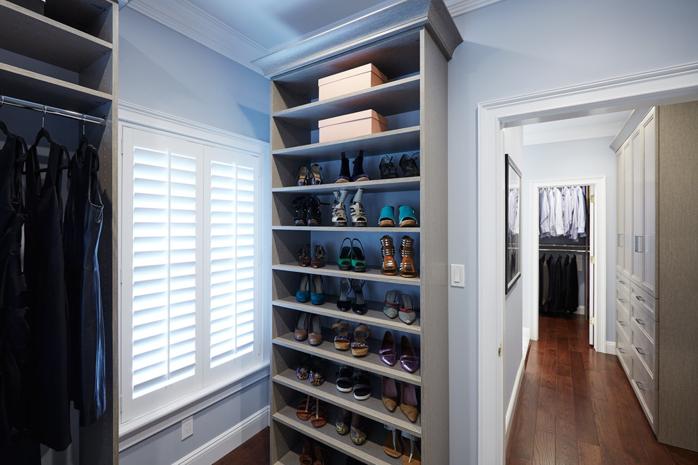 Inspiration for a medium sized classic walk-in wardrobe for women in New York with open cabinets, grey cabinets and medium hardwood flooring.