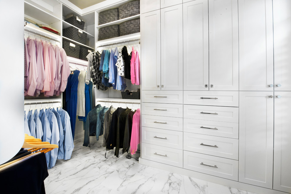 Mid-sized minimalist gender-neutral marble floor and multicolored floor walk-in closet photo in Chicago with shaker cabinets and white cabinets