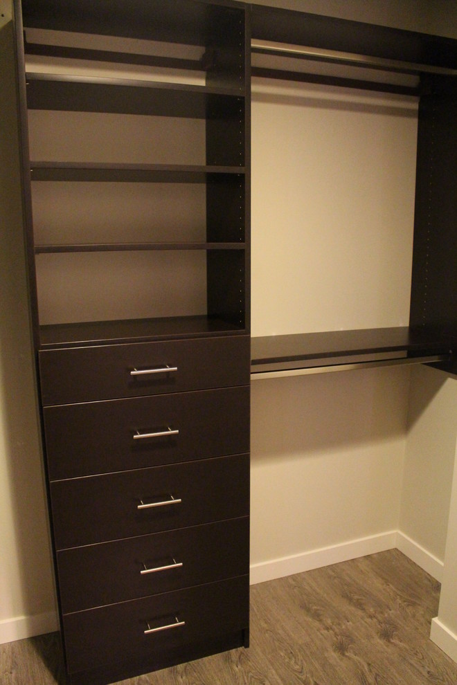 Example of a small trendy walk-in closet design in Calgary